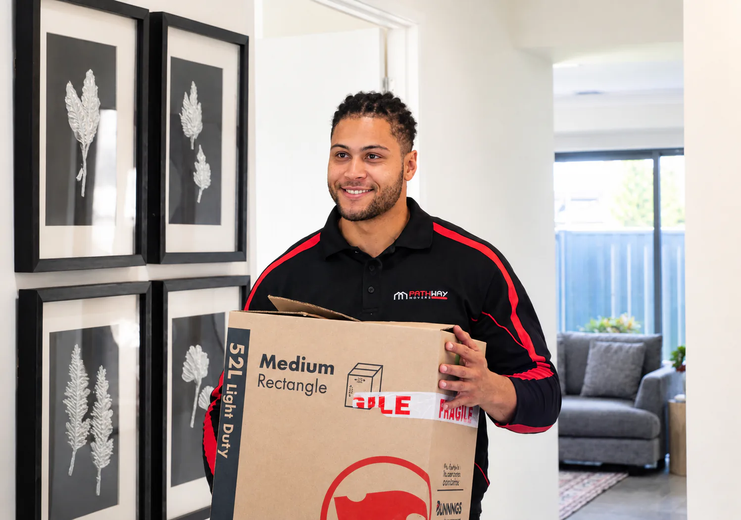 Pathway mover carrying a box of household belongings