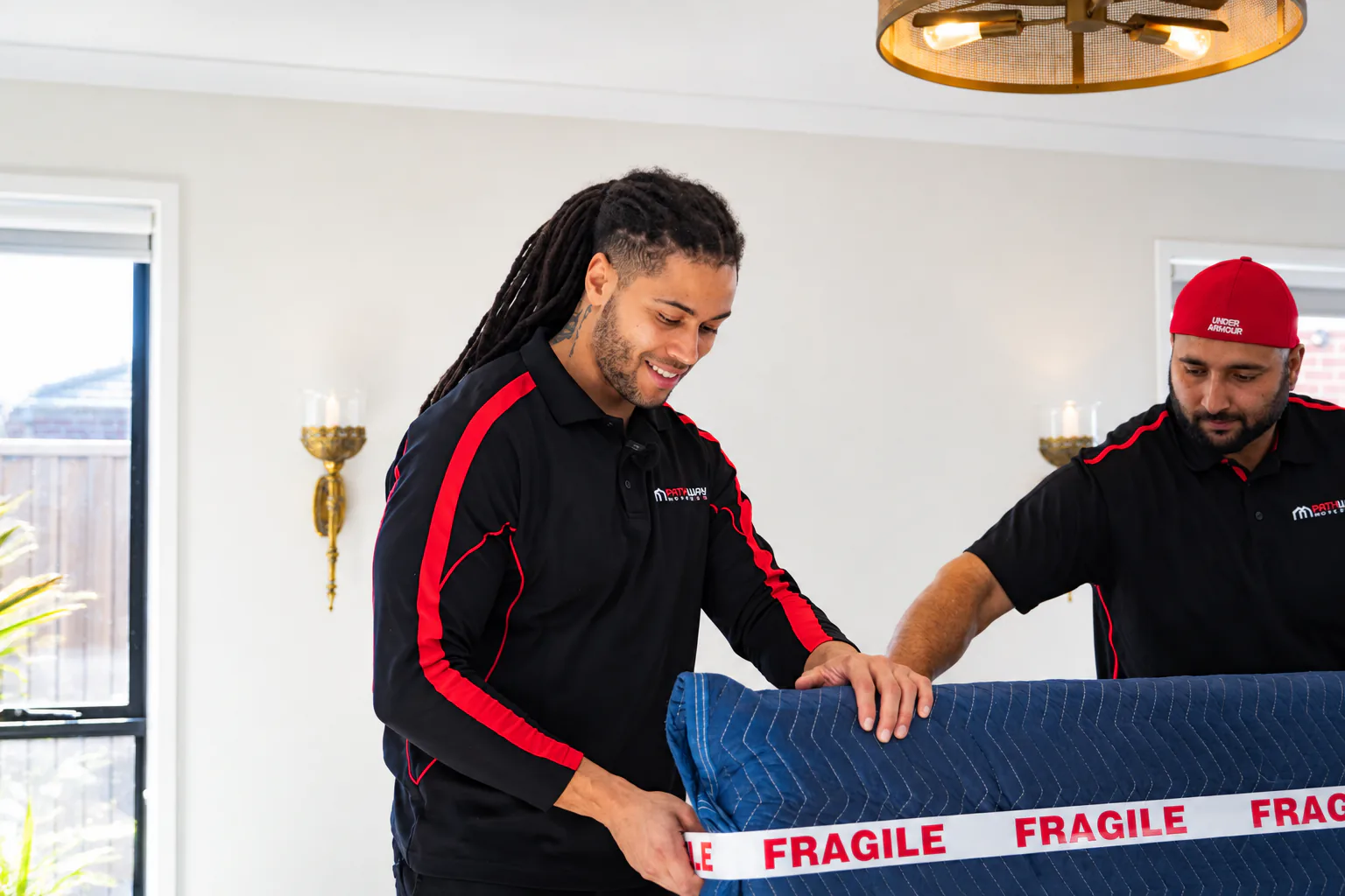 Pathway movers wrapping furniture for protection