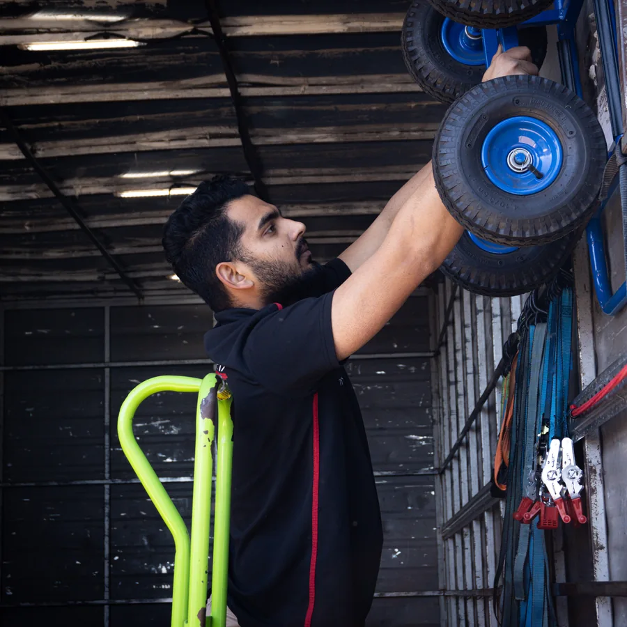 Pathway Movers team member preparing equipment inside a moving truck